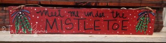 Meet me under the Mistletoe sign